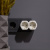 картинка Двойник электрический 16 А с заземлением и защитными шторками,  белый REXANT от магазина Сантехстрой