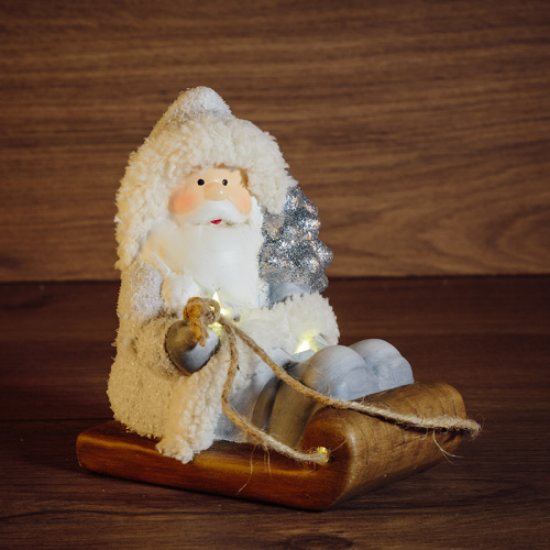 картинка Керамическая фигурка Дед Мороз на санях 13x9,5x14 см от магазина Сантехстрой